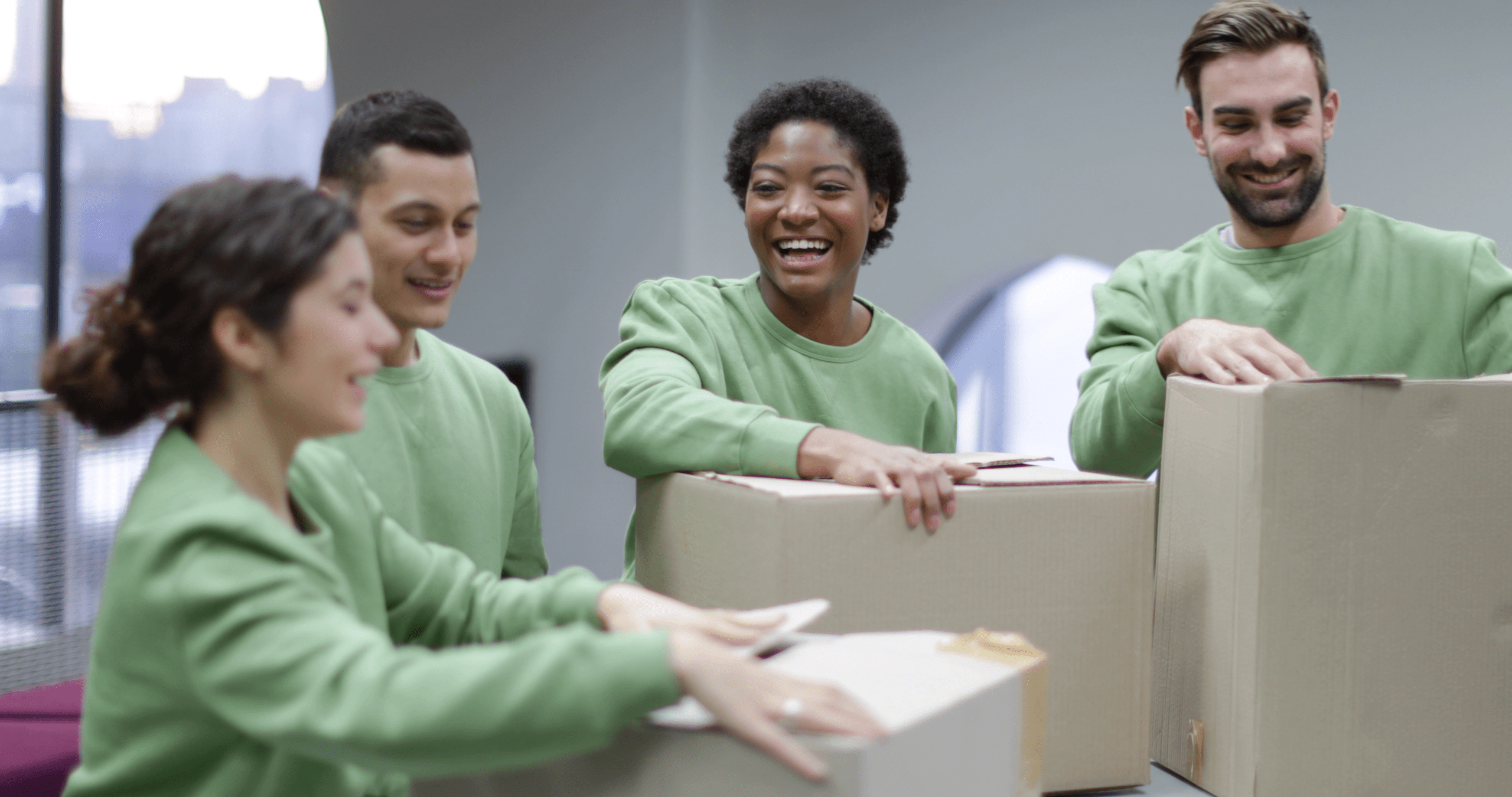 Nonprofit volunteers packing boxes at a donation drive