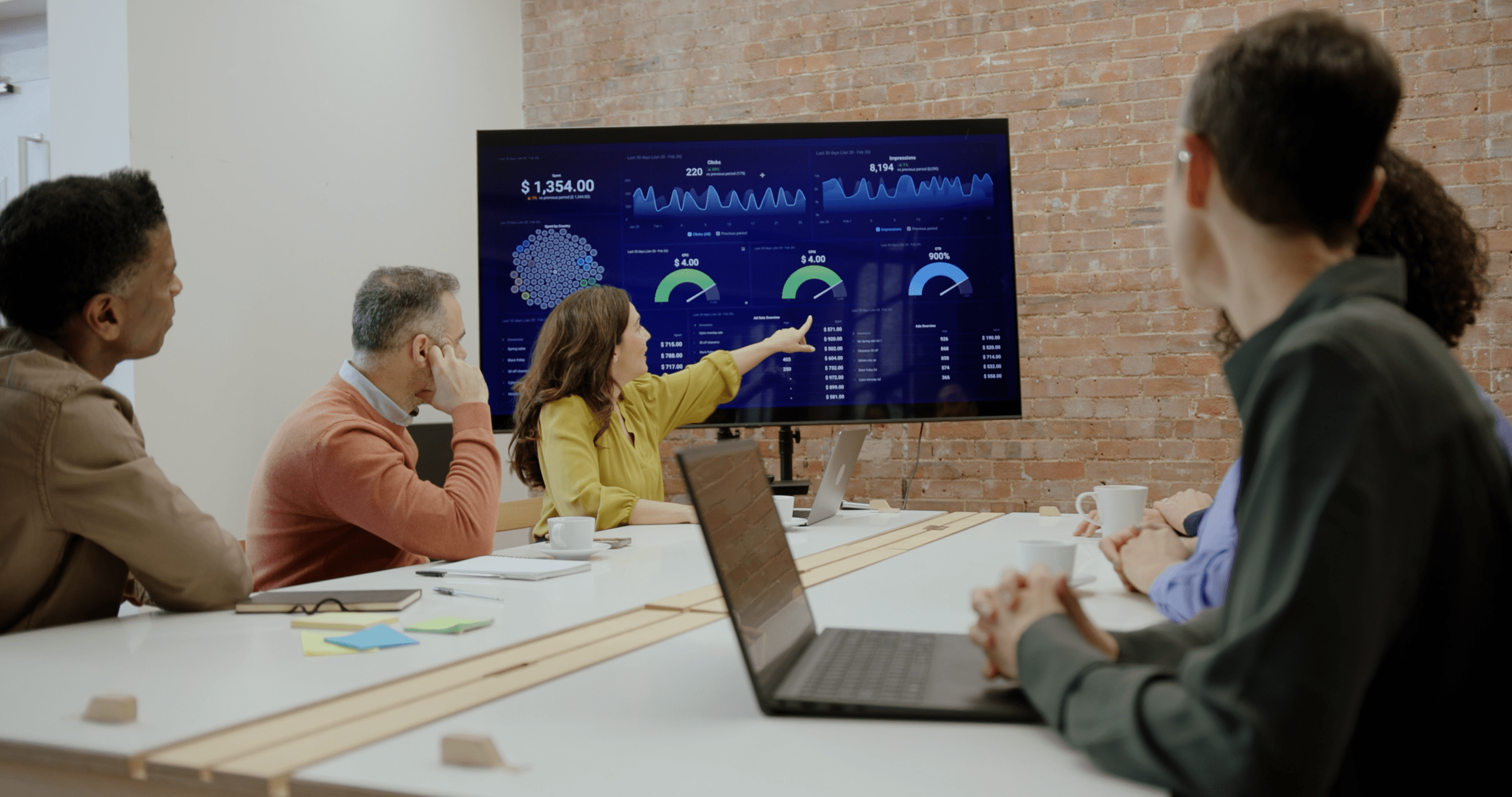 Business colleagues discussing metrics in a meeting
